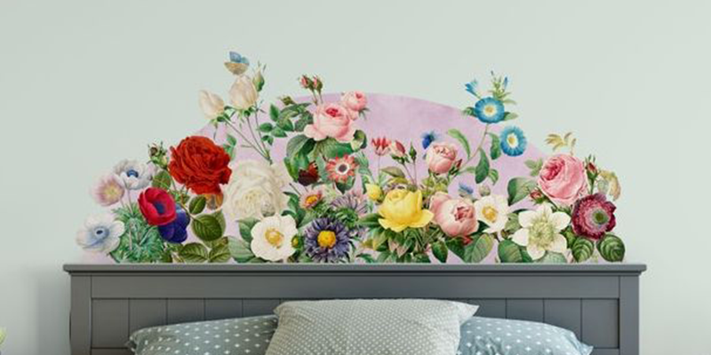 Vibrant headboard wall sticker featuring a variety of colorful flowers, including roses, daisies, and anemones, on a pastel background.
