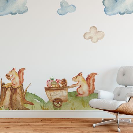 Children's wall stickers featuring playful squirrels in a woodland scene, with one pushing a cart full of acorns and mushrooms.