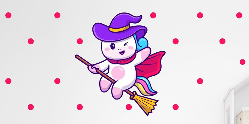 Wall decal for home with a cute cat in a witch hat and cape on a broomstick, surrounded by pink polka dots. Ideal for fun decor.