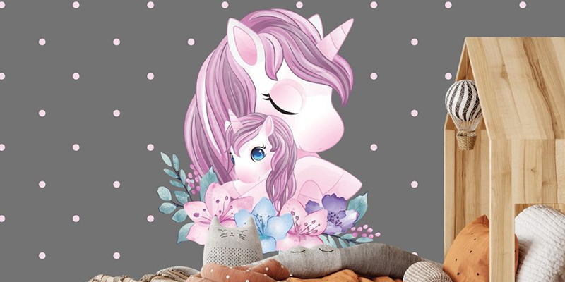 Unicorn wall sticker featuring a mother and baby unicorn with purple manes surrounded by pastel flowers, perfect for kids' rooms.