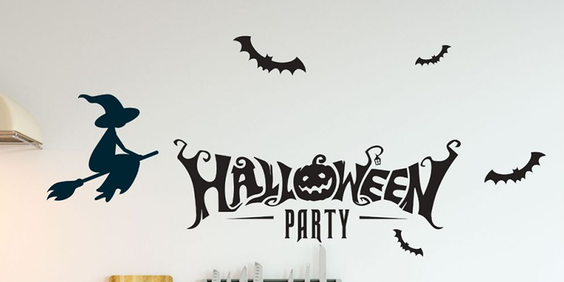 Halloween wall stickers featuring "Halloween Party" text, a flying witch, and bats, ideal for festive home decoration.