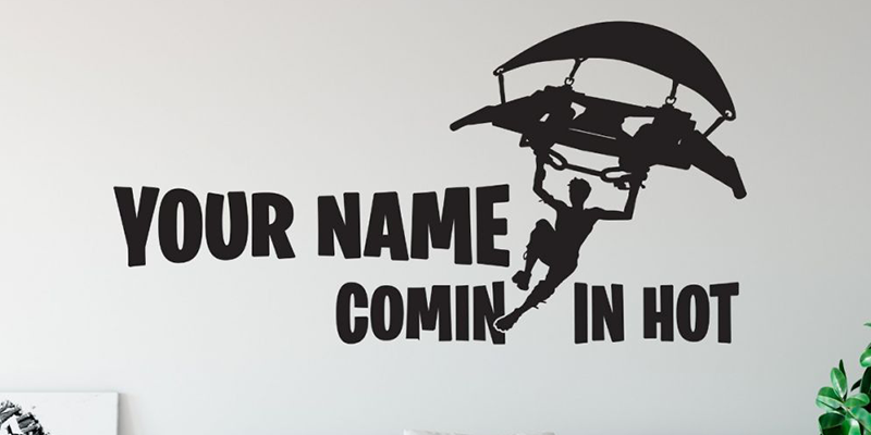 Fortnite wall decal featuring a customizable name and glider silhouette with the phrase "Comin' In Hot."