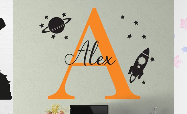 Set of wall decals featuring a headphone-wearing monkey, personalized initial with space theme, and colorful unicorn, perfect for kids' room décor.