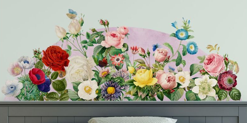 Vibrant headboard wall sticker featuring a variety of colorful flowers, including roses, daisies, and anemones, on a pastel background.