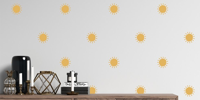 Yellow sun pattern wall stickers designed to brighten decor while preventing wall damage, ideal for easy removal.