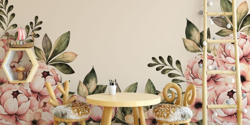 Removable wall stickers with pink floral and leafy design, adding a soft, decorative touch to a cozy seating area.