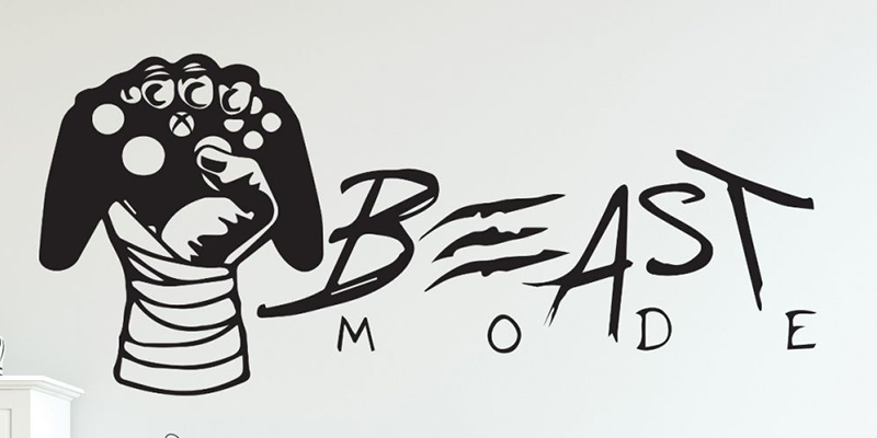 "Beast Mode" wall decal with a clenched fist holding a game controller, ideal for adding energy to gaming rooms.