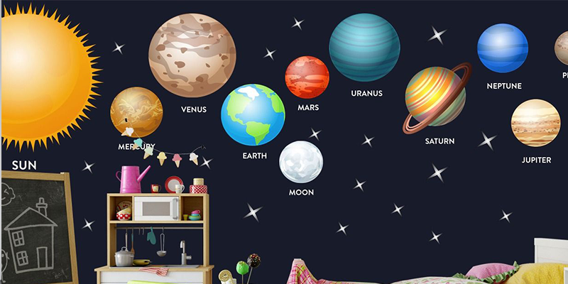 Bright solar system wall stickers featuring planets, the sun, and stars create a fun, educational space theme on nursery walls.