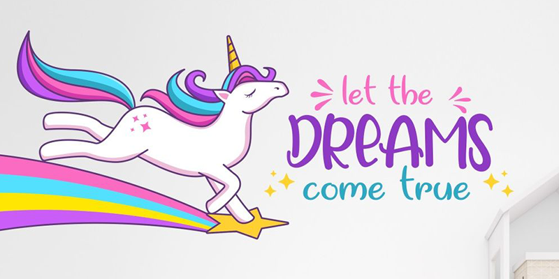 Colorful unicorn leaping on a rainbow with the phrase "Let the dreams come true," perfect wall decals for kids' rooms.