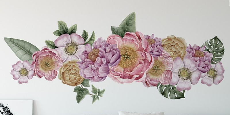 Tropical wall mural featuring pink, purple, and yellow flowers with green leaves, ideal for bedroom decor.