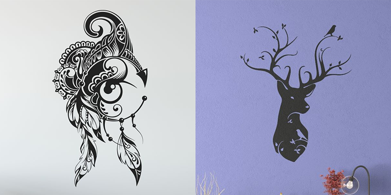 Black and white intricate animal wall decals, including a feathered owl and deer silhouette, ideal to decorate a small house with unique style.