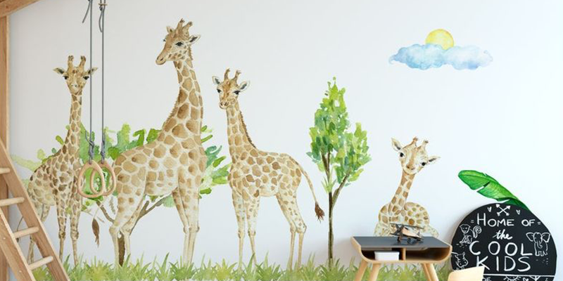 Giraffe family wall decal with trees and clouds, ideal for applying wall decals to kids' playrooms or nurseries.