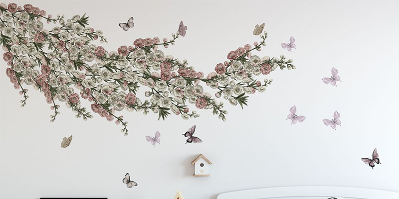 Delicate floral branch wall decal with butterflies, ideal for applying wall decals to create a serene bedroom or nursery ambiance.
