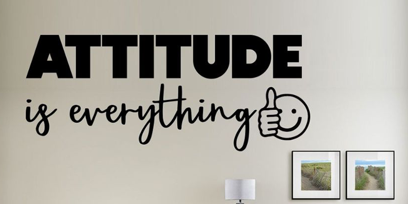 Black "Attitude is Everything" office wall decal with a thumbs-up graphic, ideal for motivating workspaces.