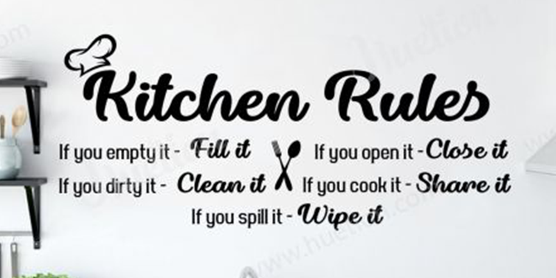 Black "Kitchen Rules" wall decal with playful font, outlining rules like "fill it," "clean it," and "wipe it."