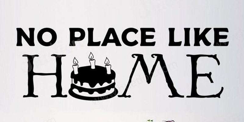 Kitchen wall sticker with the phrase "No Place Like Home" featuring a birthday cake design as part of the letter "O."
