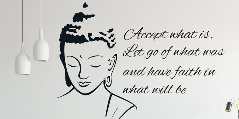 Wall decals featuring a Buddha illustration and the inspirational quote, "Accept what is, let go of what was," for peaceful decor.
