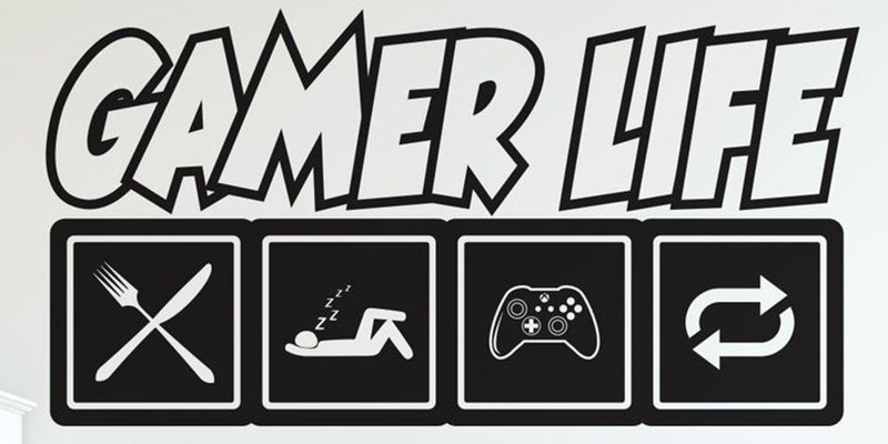 Black and white "Gamer Life" wall decal featuring icons of eating, sleeping, gaming, and repeating. Perfect gamer wall decals for kids' rooms.