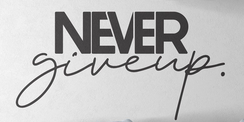 Black and white motivational wall art with bold "Never give up" text in mixed fonts, adding inspiration to any space.