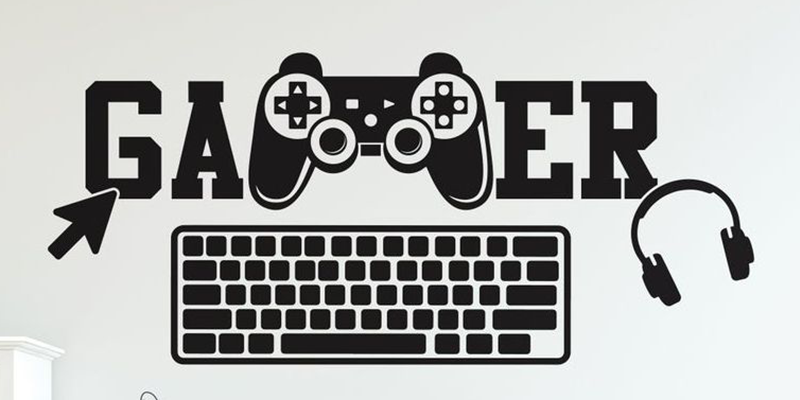 Gamer wall decal featuring a game controller, keyboard, mouse cursor, and headphones, with "Gamer" in bold letters.