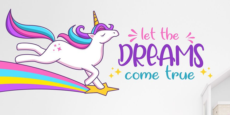 Colorful unicorn leaping on a rainbow with the phrase "Let the dreams come true," perfect wall decals for kids' rooms.