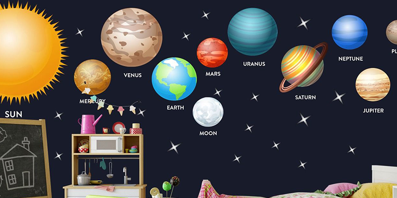 Bright solar system wall stickers featuring planets, the sun, and stars create a fun, educational space theme on nursery walls.