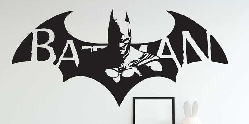 Superhero wall decal featuring Batman in front of a bat symbol with "Batman" text, ideal for superhero-themed rooms.