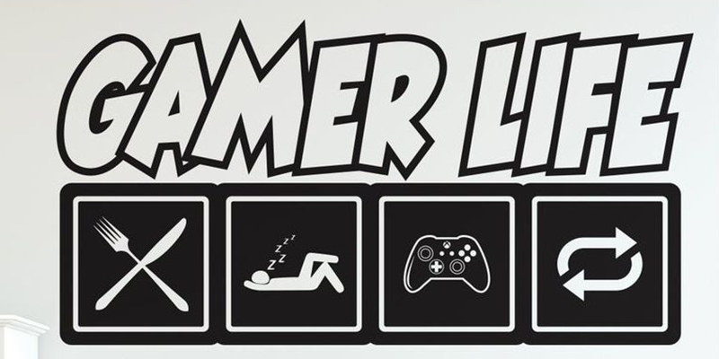 Black and white "Gamer Life" video game wall art featuring icons for eating, sleeping, gaming, and repeating.