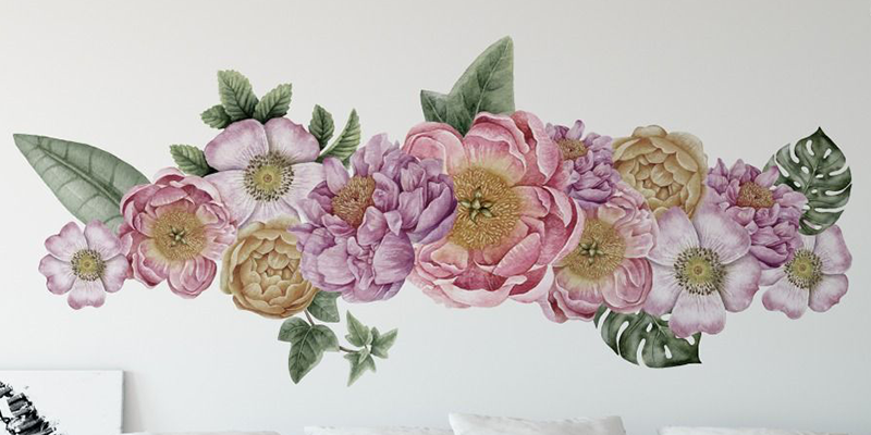Tropical wall mural featuring pink, purple, and yellow flowers with green leaves, ideal for bedroom decor.