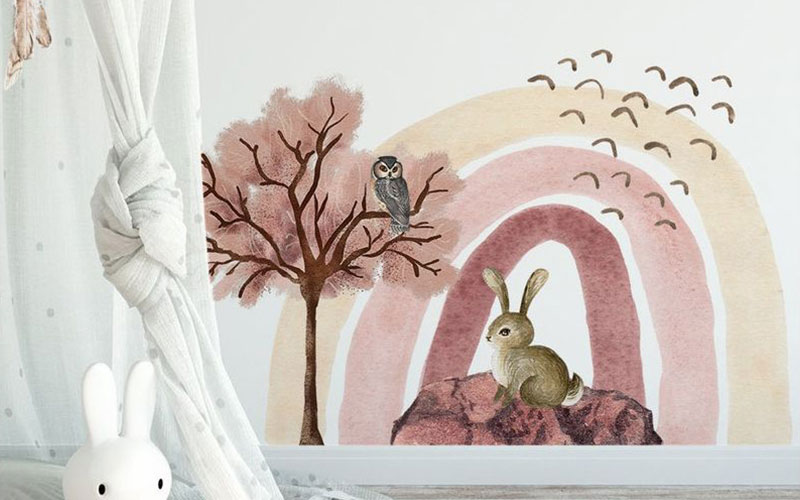 Birds wall stickers with flying birds, a tree, and an owl, alongside a rabbit under a muted rainbow, creating a woodland scene.