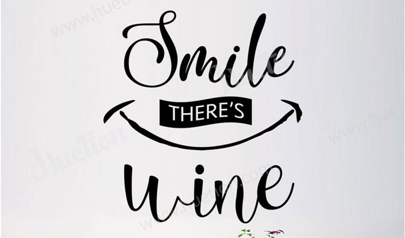 Decorative wall sticker with the quote "Smile, There's Wine," ideal for adding a playful touch to kitchen decor.