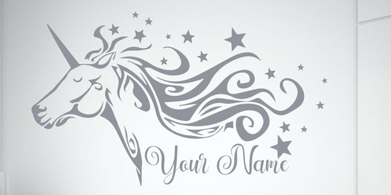 Custom wall decal featuring a unicorn head with flowing mane and stars, personalized with "Your Name" text option.