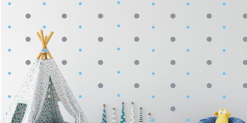 Playful gray and blue polka dot Boho wall stickers decorate a nursery, adding a stylish and calming touch to the room.