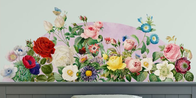 Vibrant headboard wall sticker featuring a variety of colorful flowers, including roses, daisies, and anemones, on a pastel background.