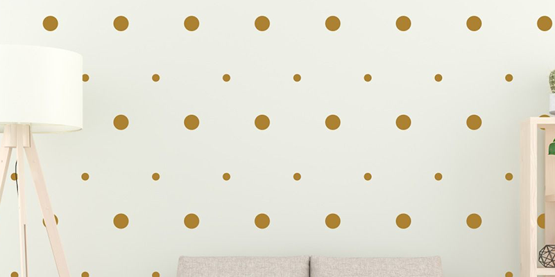 Boho wall stickers featuring gold polka dots in various sizes, ideal for adding a chic and minimalist touch to any room.