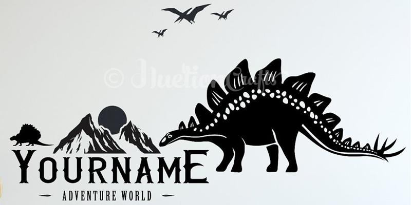 Dinosaur wall decal featuring a Stegosaurus, mountains, and customizable name text, perfect for creating a personalized adventure theme.