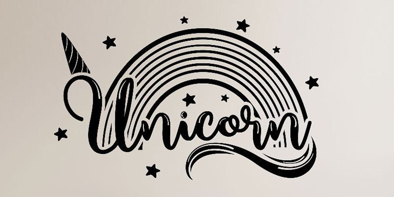Stylish unicorn wall decal featuring a black rainbow, stars, and a unicorn horn, perfect for adding magic to any room.