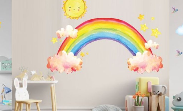 Rainbow wall decals with clouds, stars, and cartoon accents, ideal for adding a joyful, colorful touch to children's room decor.