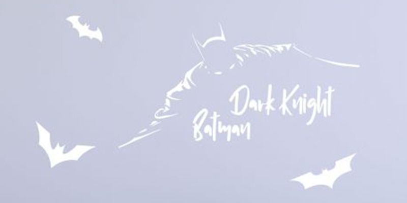 Batman superhero wall stickers featuring "Dark Knight" text and bat silhouettes, adding a bold touch to a child's room decor.