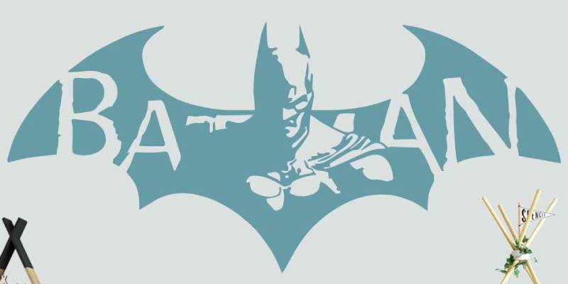 Nursery wall sticker featuring a stylized Batman logo in blue, ideal for adding a superhero theme to a child's room.