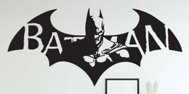 Black Batman superhero wall sticker with bold lettering and bat symbol, ideal for enhancing a child's superhero-themed room.