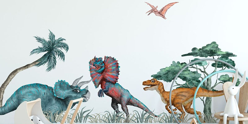 Vibrant dinosaur wall stickers featuring a triceratops, velociraptor, and pterodactyl, creating an adventurous atmosphere in a child's room.