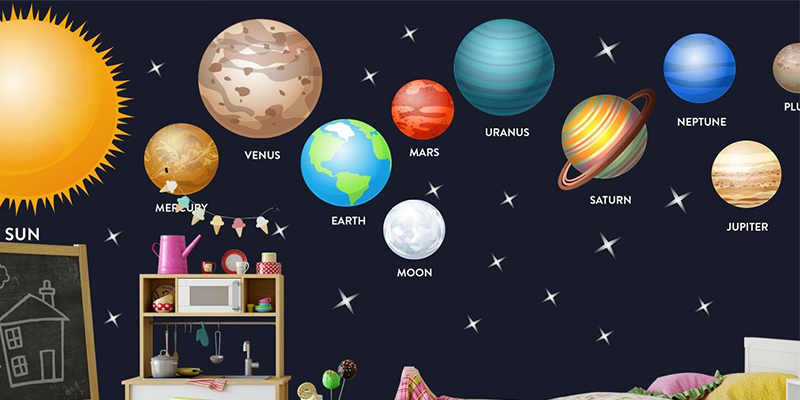 Bright solar system wall stickers featuring planets, the sun, and stars create a fun, educational space theme on nursery walls.