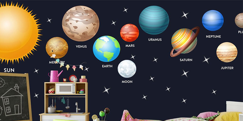 Bright solar system wall stickers featuring planets, the sun, and stars create a fun, educational space theme on nursery walls.