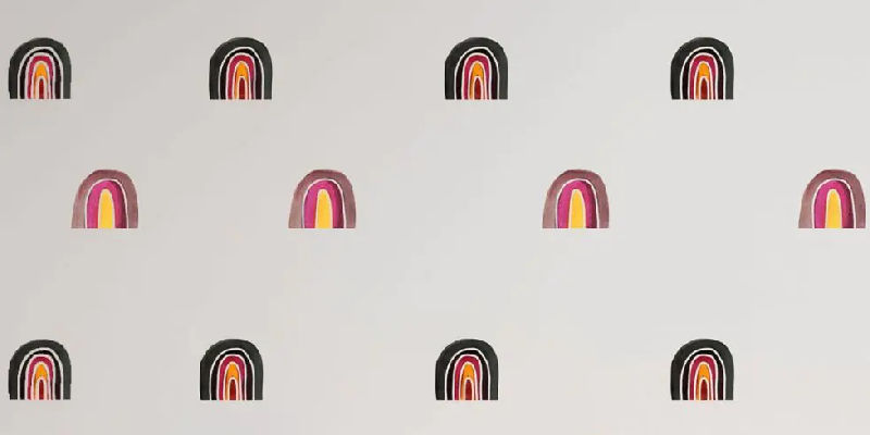 Large rainbow wall stickers with vibrant pink, orange, and black hues spaced evenly on a white background.